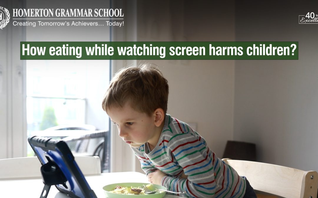 How does eating while watching the screen harm children?